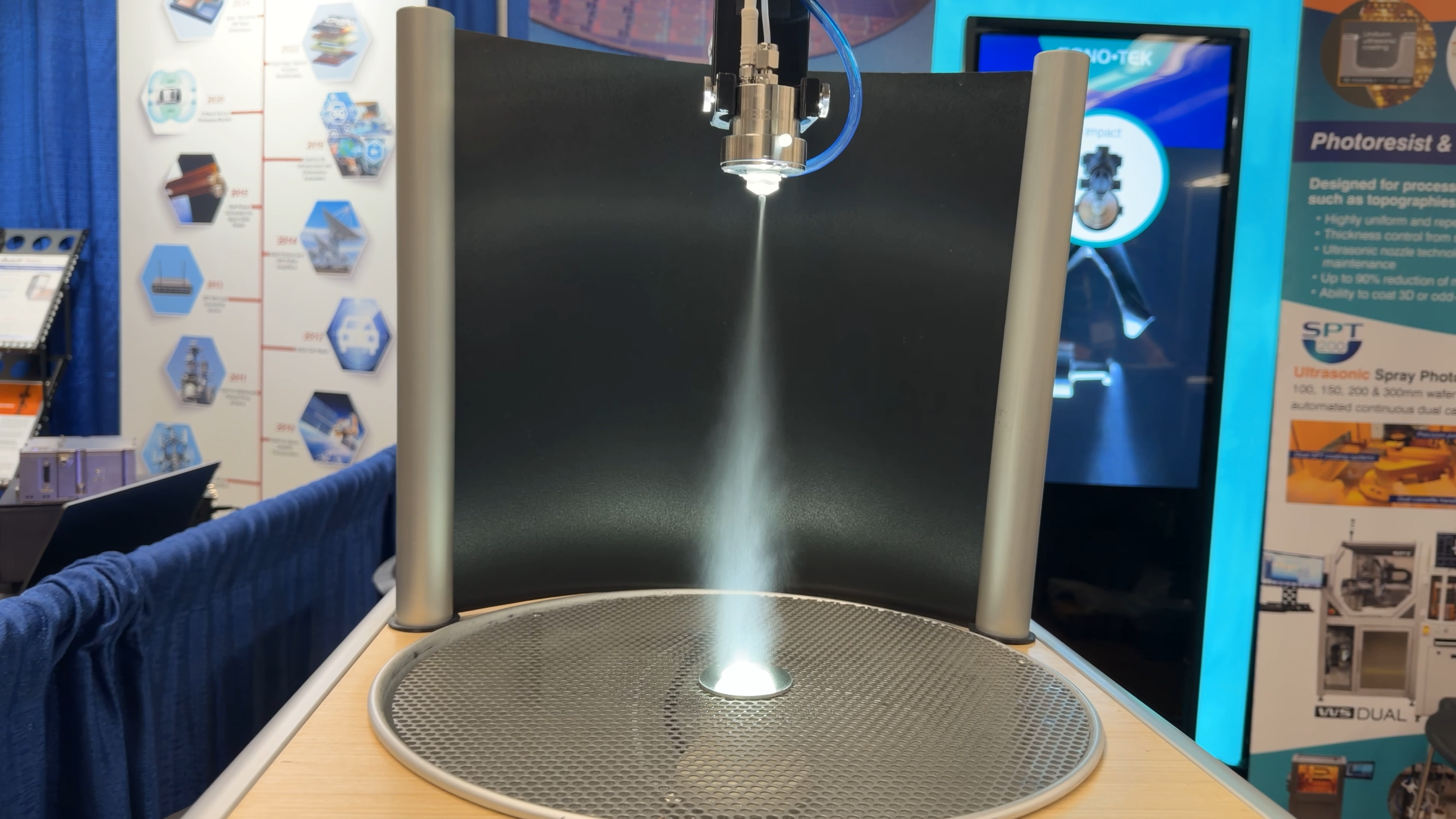 Documentary still — ultrasonic spray equipment demo